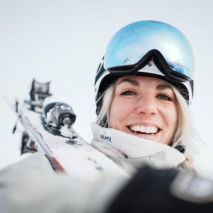 Kaveri Mehta, Lead Design Curator at BloomfieldLab, reviewing corporate floral arrangements